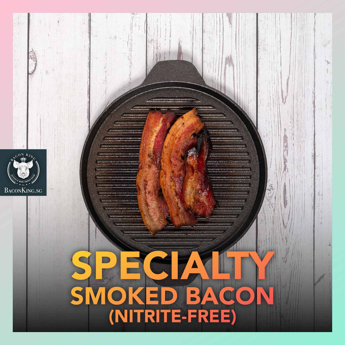 Slices of Nitrite-free Specialty Smoked Bacon on Stone Plate with Bay Leaves, Rosemary, Thyme, Cloves, Applewood chips decorating the side, against a marble background